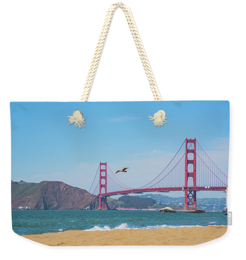 Seagull flying over Golden Gate Bridge - Weekender Tote Bag