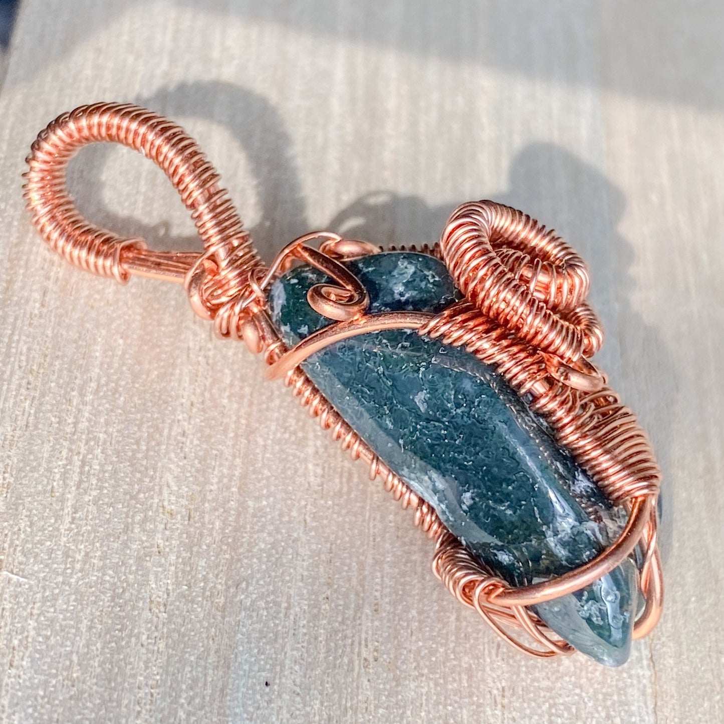 Abundance in New Beginnings Moss Agate Copper Wire wrapped Pendant