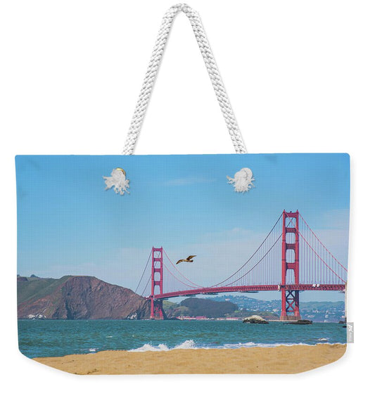 Seagull flying over Golden Gate Bridge - Weekender Tote Bag