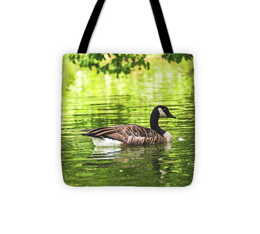 Solitary Goose on Tranquil Pond - Tote Bag