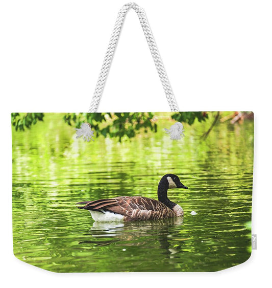 Solitary Goose on Tranquil Pond - Weekender Tote Bag